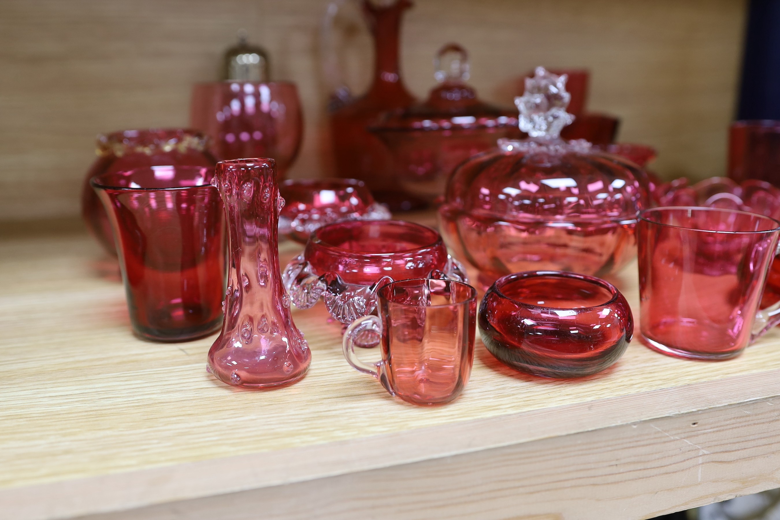 A collection of Cranberry glassware